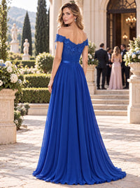Back view of a chiffon A-line mother of the bride dress with off-the-shoulder neckline, lace bodice, ruched waistband and floor-length skirt.