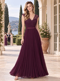 Front view of a lace chiffon A-line mother of the bride dress with V-neckline, lace cap sleeves, ruched crossover bodice and floor-length skirt.