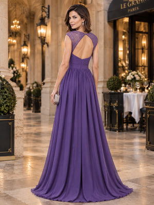 Back view of a purple chiffon A-line mother of the bride dress with lace shoulder panels, open keyhole back and floor-length skirt.