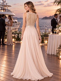 Back view of a floral lace chiffon A-line mother of the bride dress with illusion lace panel, floral appliqué and center back zipper.