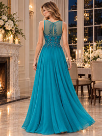 Back view of an embroidered floral chiffon A-line mother of the bride dress with illusion floral panel, keyhole back and flowing floor-length skirt.