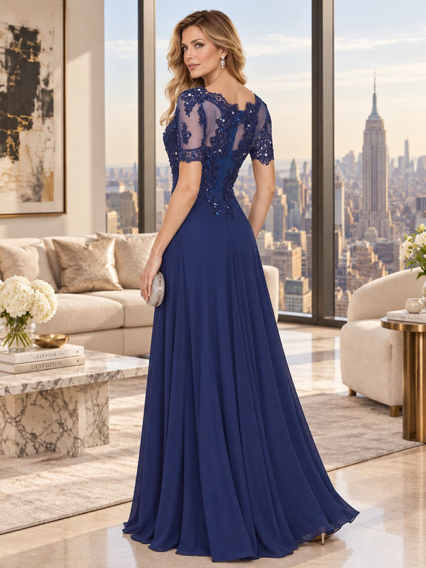 Back view of a beaded lace chiffon A-line mother of the bride dress with sheer floral lace back, short sleeves and center-back zipper.
