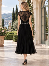 Back view of a floral lace chiffon A-line mother of the bride dress with sheer lace back, jeweled waist and center-back zipper.