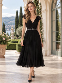 Front view of a floral lace chiffon A-line mother of the bride dress with V-neckline, cap sleeves and embellished tea-length skirt.