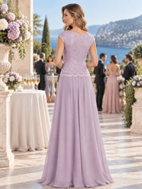 Back view of a floral lace chiffon A-line mother of the bride dress with fitted lace bodice, scalloped waist detail and center-back zipper.