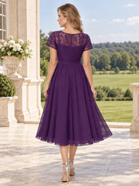 Back view of a floral lace chiffon A-line mother of the bride dress with sheer lace upper back, short sleeves and center-back zipper.