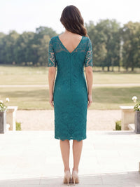 Back view of a floral lace sheath mother of the bride dress with V-back, sheer lace detailing and center-back zipper.