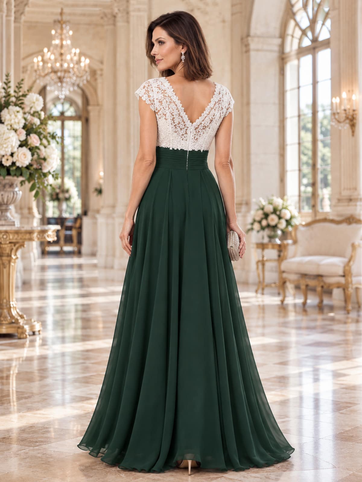 Back view of a floral lace chiffon A-line mother of the bride dress with deep V-back, ruched waist and center-back zipper.