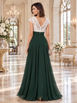 Back view of a floral lace chiffon A-line mother of the bride dress with deep V-back, ruched waist and center-back zipper.