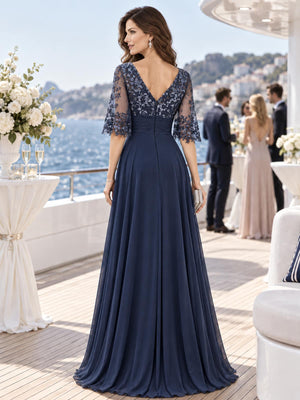 Back view of a floral lace chiffon A-line mother of the bride dress with deep V lace back and center-back zipper.