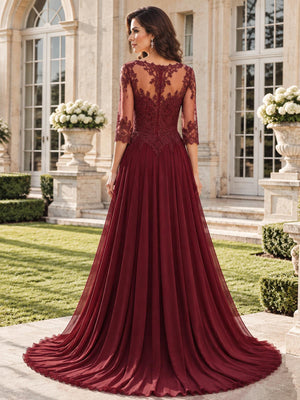 Back view of a floral lace chiffon A-line mother of the bride dress with sheer floral lace back, three-quarter sleeves and sweep train.