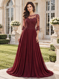 Front view of a floral lace chiffon A-line mother of the bride dress with illusion neckline, three-quarter lace sleeves and floor-length skirt.