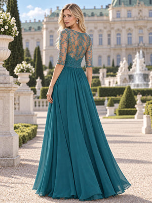 Back view of a floral lace chiffon A-line mother of the bride dress with sheer lace back, elbow sleeves and center-back zipper.