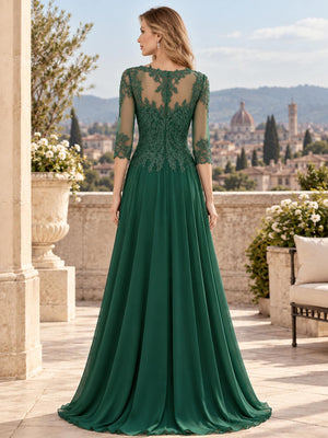Back view of a floral lace chiffon A-line mother of the bride dress with sheer lace back and center-back zipper.