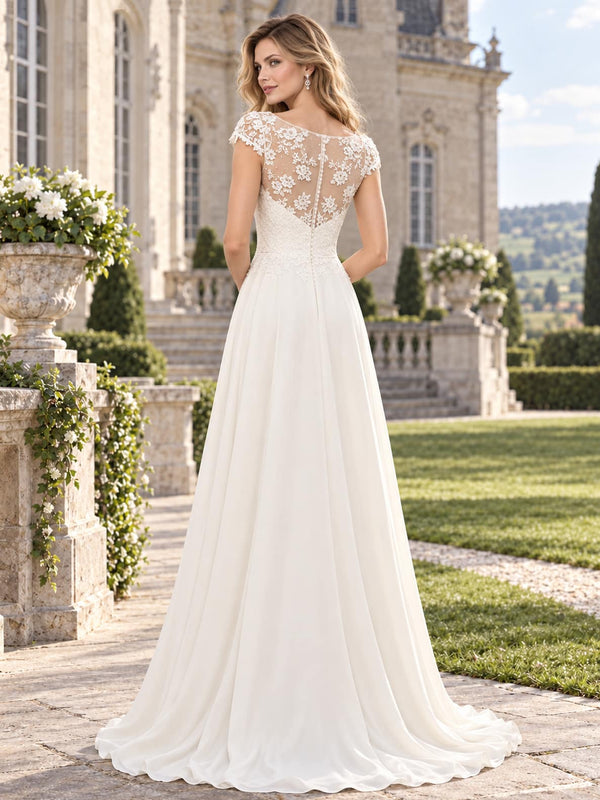 Back view of a floral lace chiffon A-line mother of the bride dress with sheer floral lace back and center-back zipper.