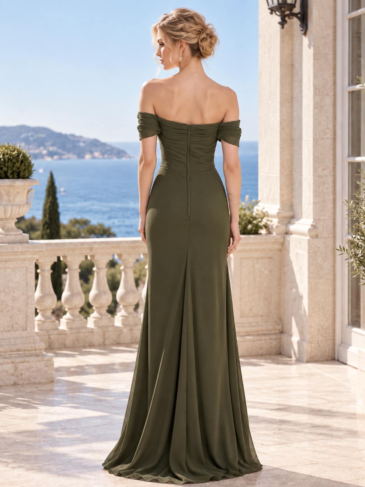 Back view of an off-shoulder chiffon mother of the bride dress with fitted bodice, floor-length sheath silhouette and center-back zipper.