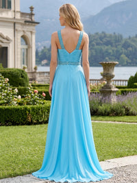 Back view of a chiffon A-line mother of the bride dress with beaded straps, low V-back, ruched bodice and center-back zipper.