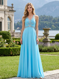Front view of a chiffon A-line mother of the bride dress with V-neckline, beaded straps, embellished waist and floor-length skirt.