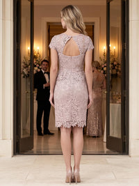 Back view of a floral lace sheath mother of the bride dress with sheer keyhole back and center-back zipper.