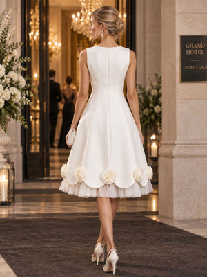 Back view of a satin A-line mother of the bride dress with princess seams, center-back zipper and 3D rose appliqué hem.