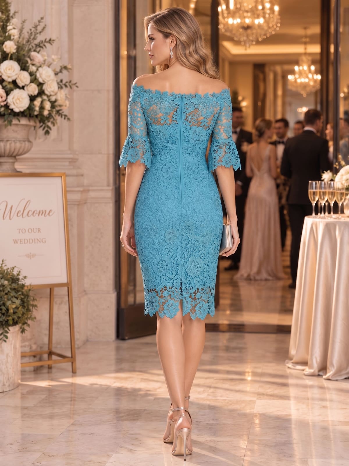 Back view of a floral lace sheath mother of the bride dress with off-shoulder neckline, scalloped lace sleeves and center-back zipper.