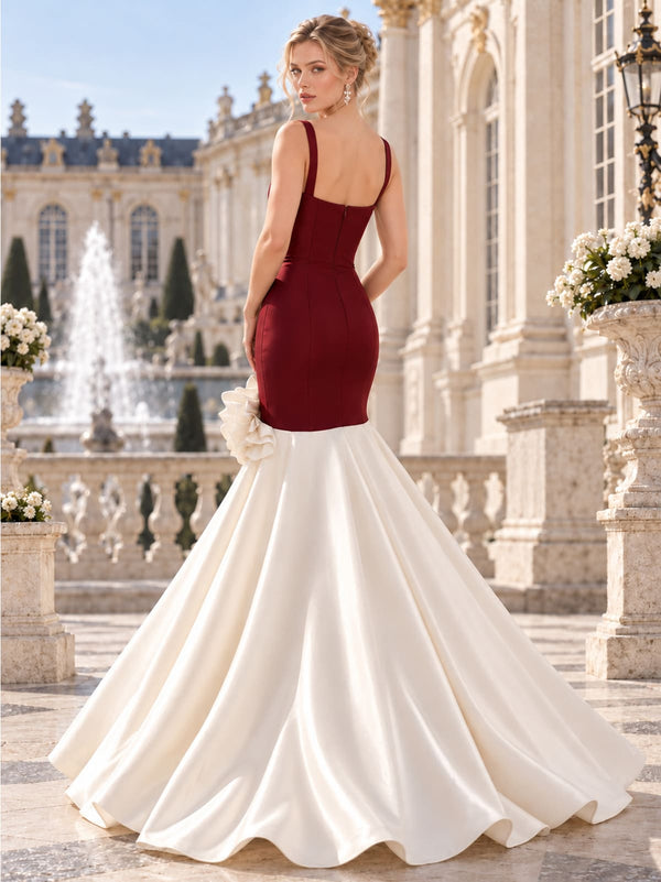 Back view of a two-tone satin mermaid mother of the bride dress with fitted bodice, floral hip detail and center-back zipper.